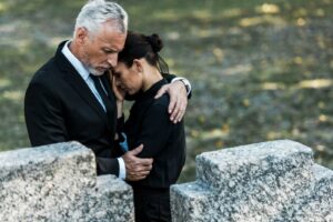 Family mourns during funeral.