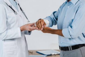 Man wonders who pays for workers' comp while receiving treatment.