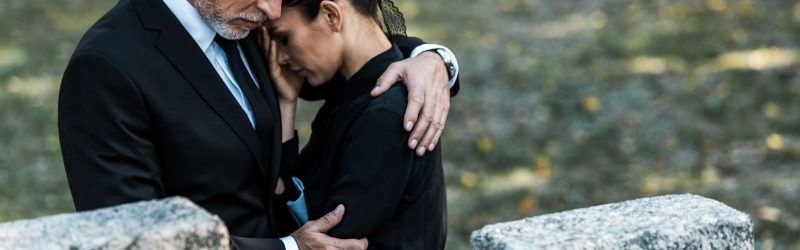 Family mourns during funeral.